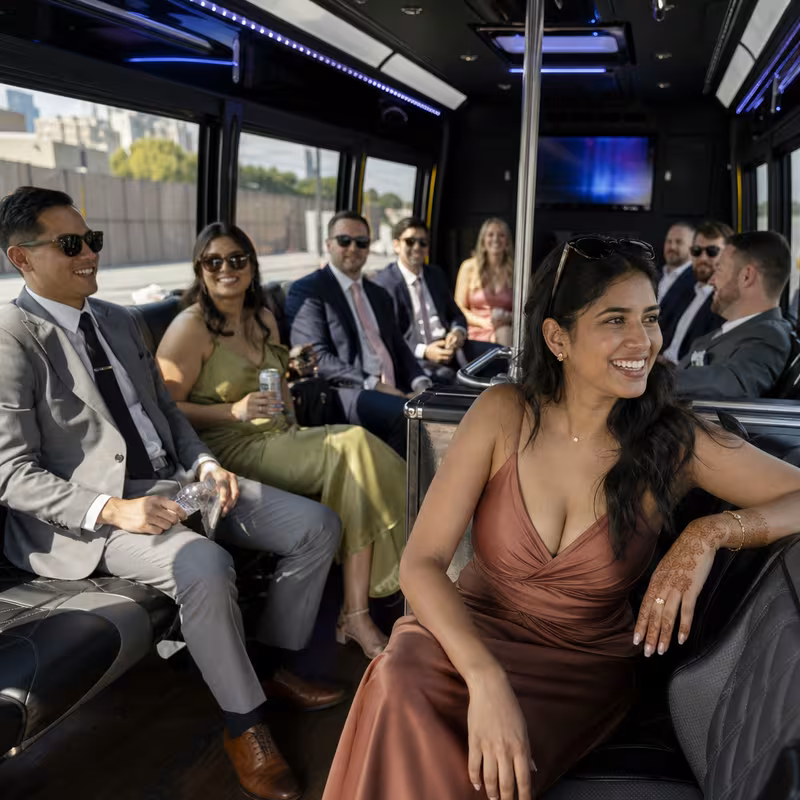 Wedding guests seated inside a Philadelphia party bus