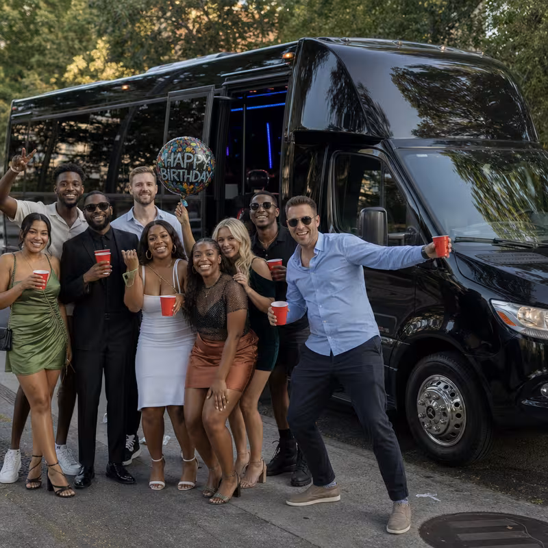 Group boarding a white charter bus for Birthday Transportation transportation in Philadelphia