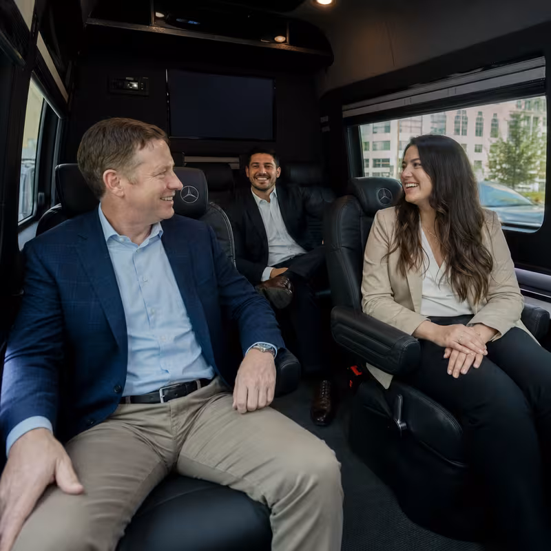 Group boarding a white charter bus for Corporate Transportation transportation in Philadelphia