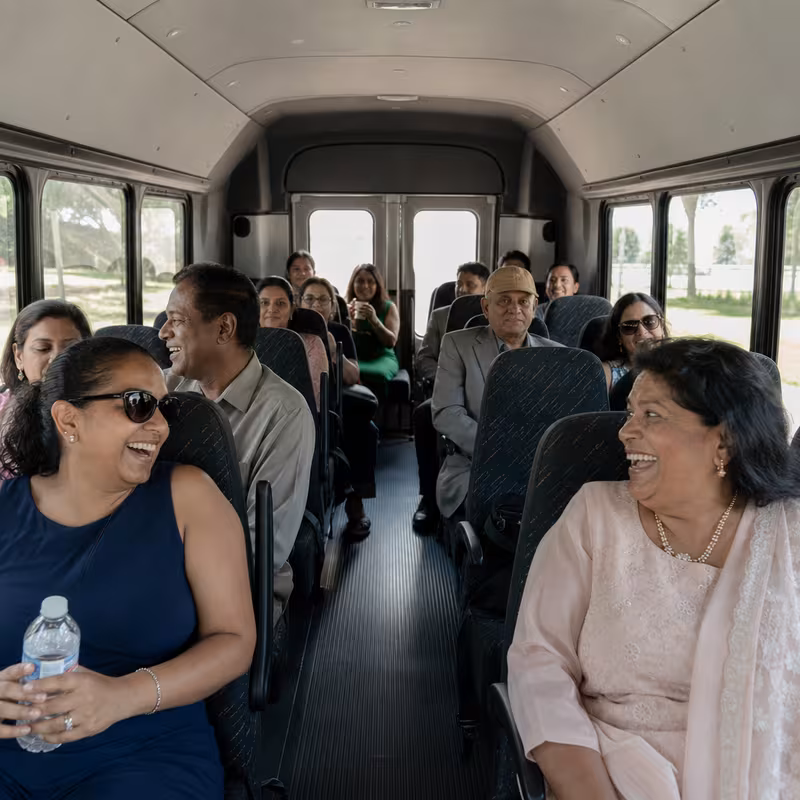 Group boarding a white charter bus for Private Event Transportation transportation in Philadelphia
