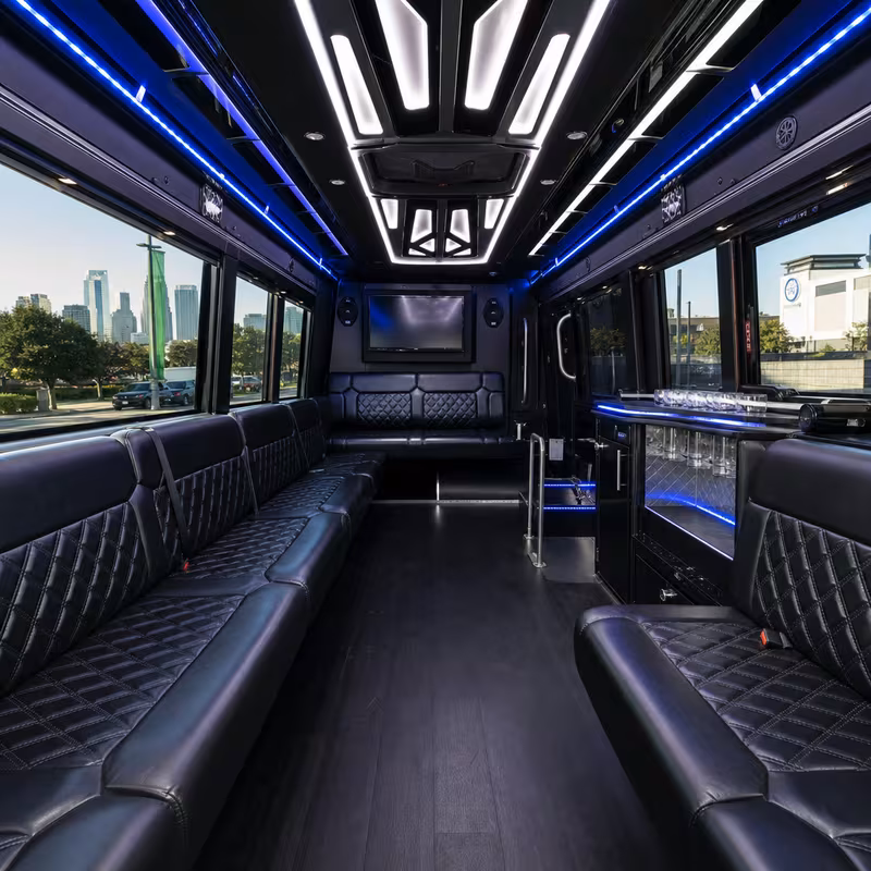 Party bus interior with wraparound leather seating and LED lighting in Philadelphia