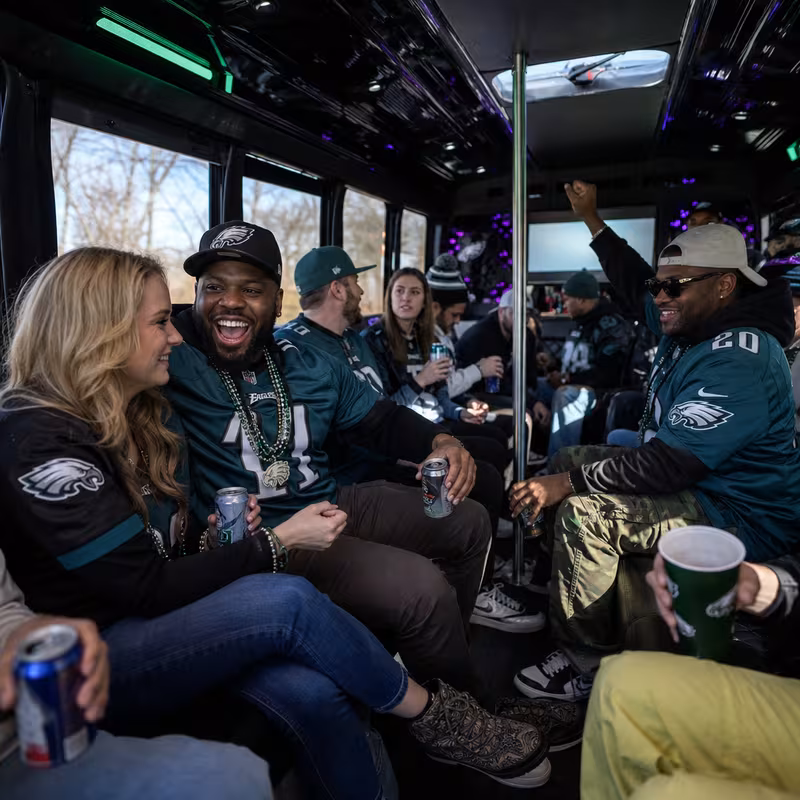 Group boarding a white charter bus for Sporting Event Transportation transportation in Philadelphia