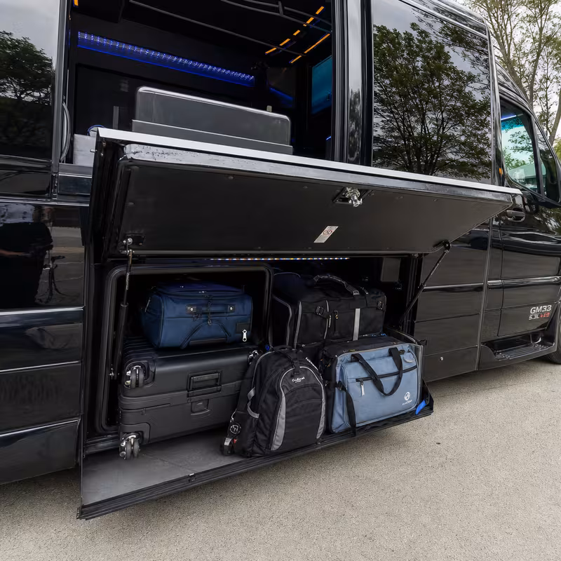 Party bus interior with wraparound leather seating and LED lighting in Philadelphia