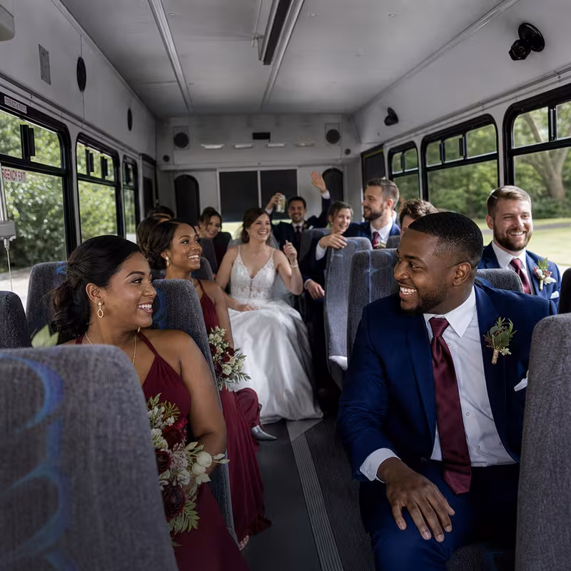 Group boarding a white charter bus for Wedding Transportation transportation in Philadelphia