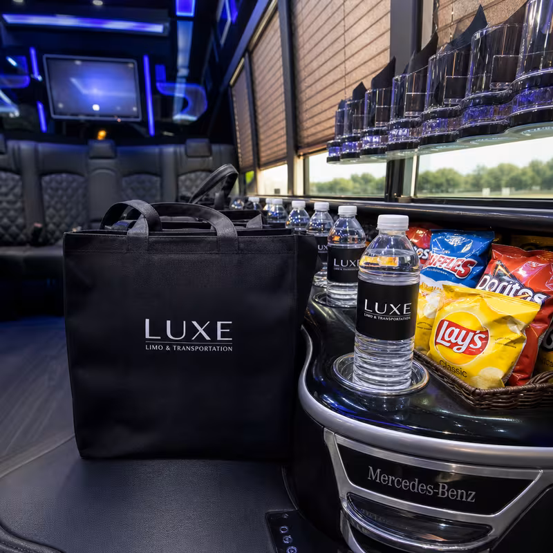Party bus interior with wraparound leather seating and LED lighting in Philadelphia